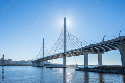 Highway modern bridge over the river and bay.