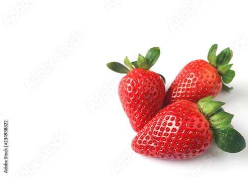 Fototapeta Naklejka Na Ścianę i Meble -  Three Bright Color Red Fresh Ripe Strawberries Isolated on White Background with Free Space for Design or Text 