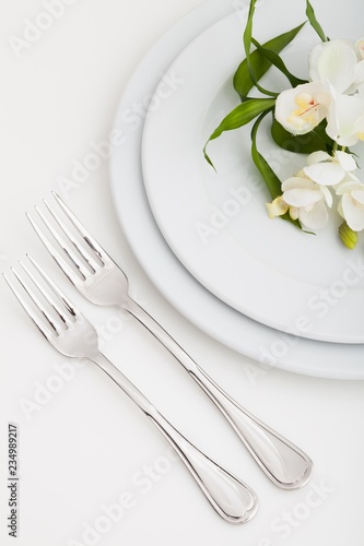 Table Setting with Plate, Forks and Flowers