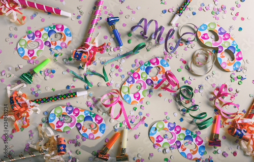 Carnival or birthday party. Confetti and serpentines on pastel grey background