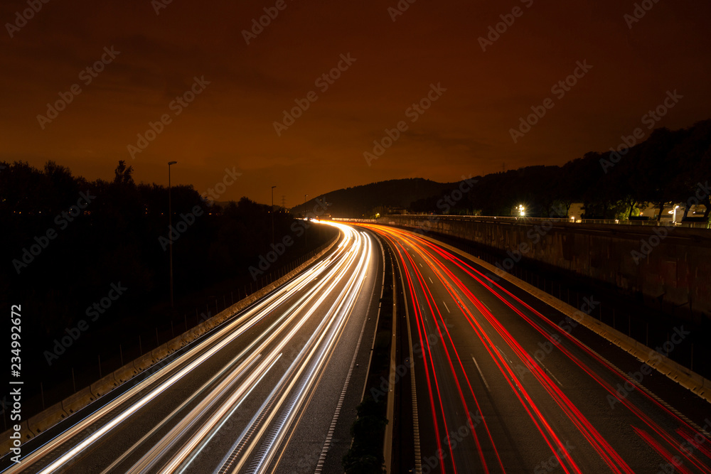 Commuting Traffic Light Trails in Highway at Night Close to Barcelona (Spain)