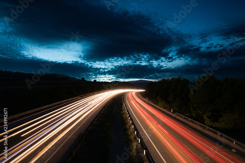 Highway With Traffic Light Trails and Beautiful Sky in the Dusk in Barcelona Province (Spain) photo