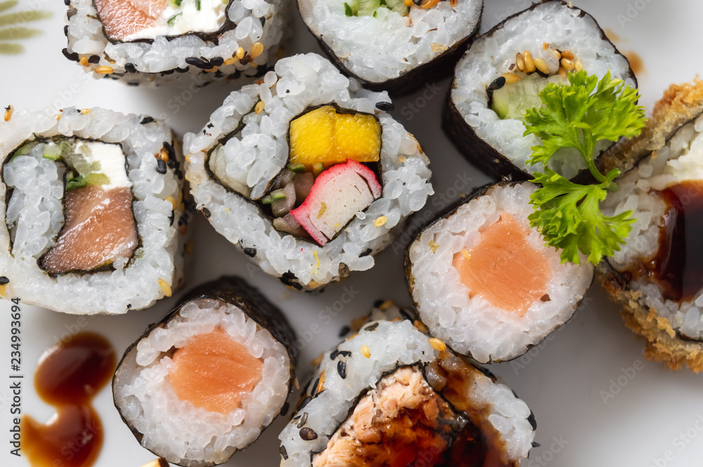 Japanese food on a white plate seen from top Japanese food on a white plate seen from top
