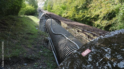 Large water pipe feeding hydroelectric power plant. Near Gedre in the Pyrenees, France. photo