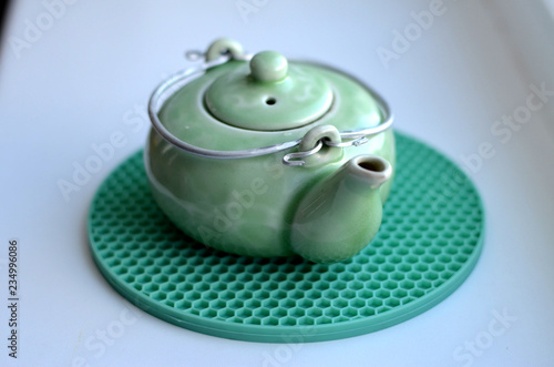 teapot on green base