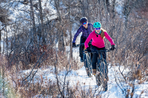 Two Women riding Fat Bikes in the Snow