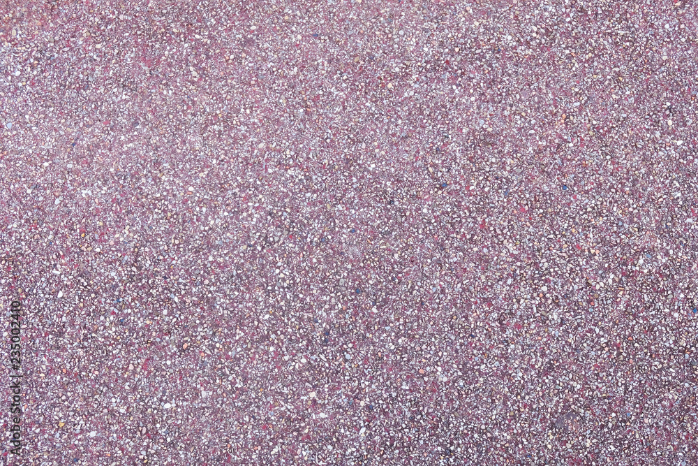 Fototapeta premium Purple asphalt pavement texture background, close up with little stones for design.