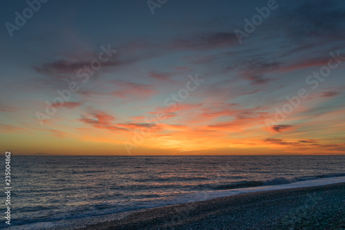 Beautiful dramatic sunset against the sea. © vvicca