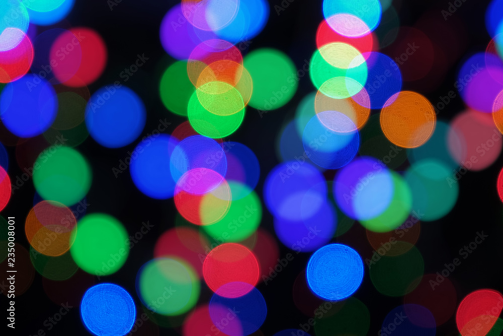 Blurred colorful big bokeh lights. Festive abstract background on black Blurred colorful big bokeh lights. Festive abstract background on black