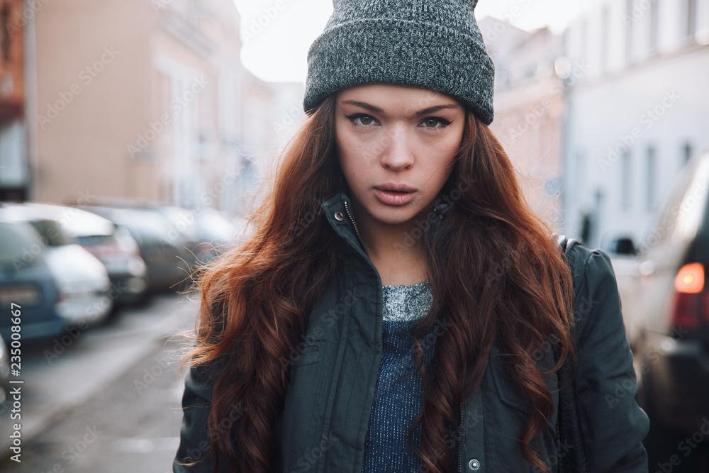 Large portrait of a girl in a hat on the street Large portrait of a girl in a hat on the street