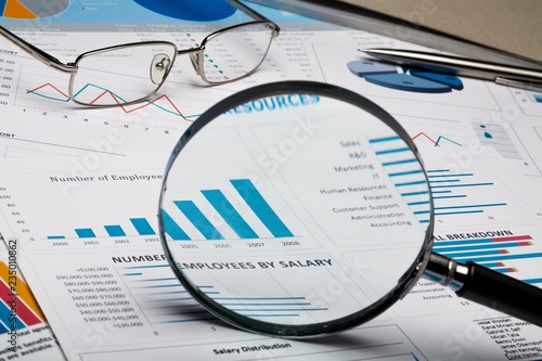 Magnifying Glass on Business Graphs and Charts