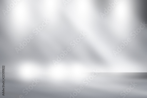 blank immense white and gray studio room with backdrop spotlight for display or montage your product. Dark tone.