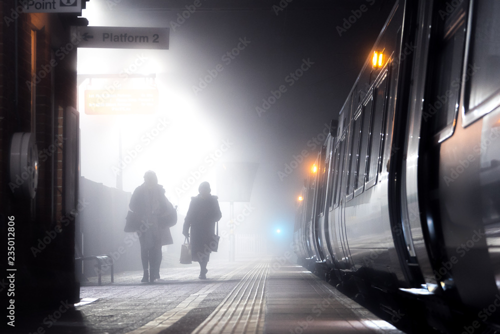 People on train platform People on train platform