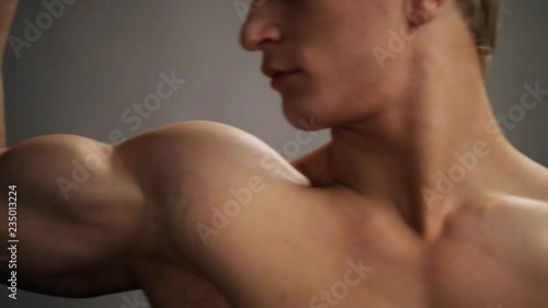 Young topless rolled man posing