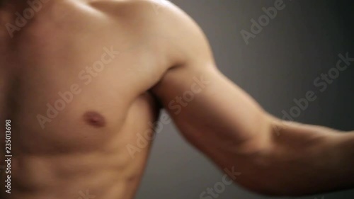 Young topless rolled man posing