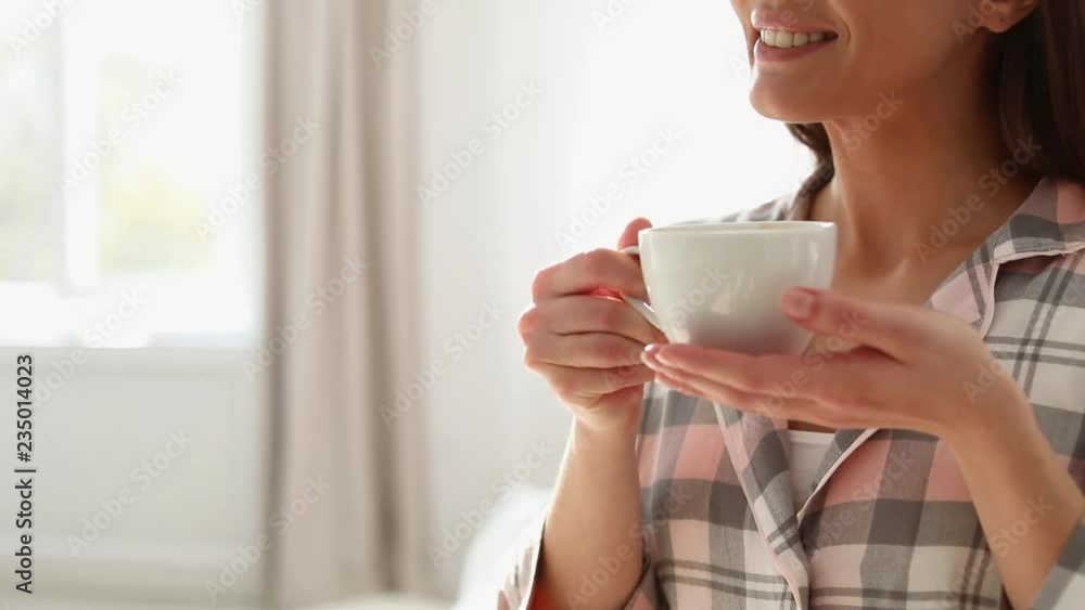 Beautiful young woman drinking coffee at home on lazy morning. Space for text

