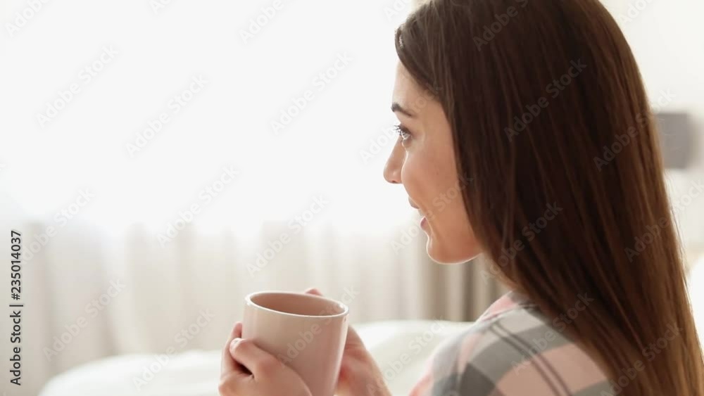 Beautiful young woman drinking coffee at home on lazy morning. Space for text
Beautiful young woman drinking coffee at home on lazy morning. Space for text
