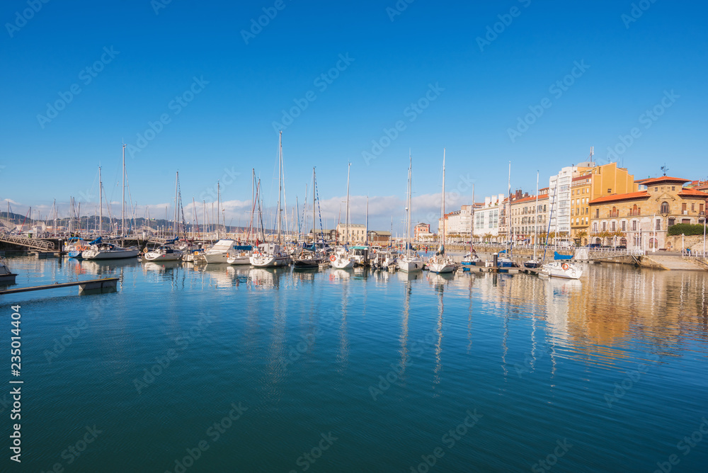 Gijon cityscape. Yatchs in marina port of Gijon, Asturias, Spain.