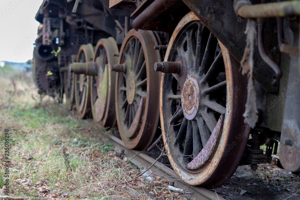 Old destroyed steam engines. Forgotten railway station in central europe.
