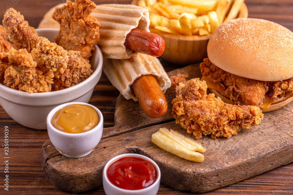 Delicious but unhealthy food with ketchup and mustard Delicious but unhealthy food with ketchup and mustard