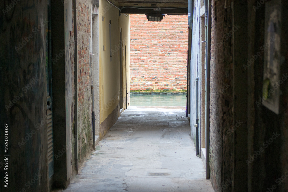 Fototapeta premium A not touristy spot in Venice. The beauty of this city is also in the hidden and unknown residential areas where the architecture is old, popular and simple as the materials it is made of