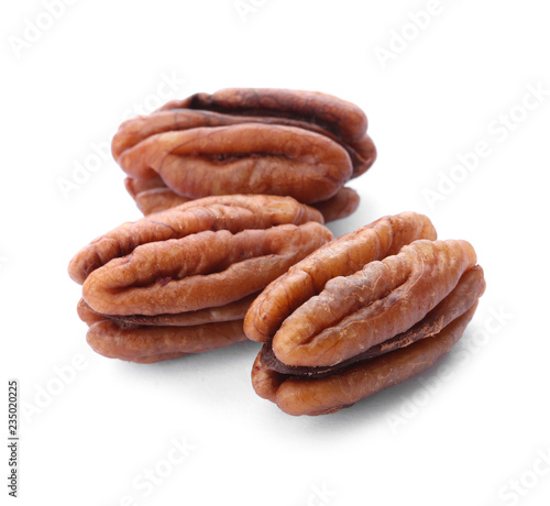 Ripe shelled pecan nuts on white background