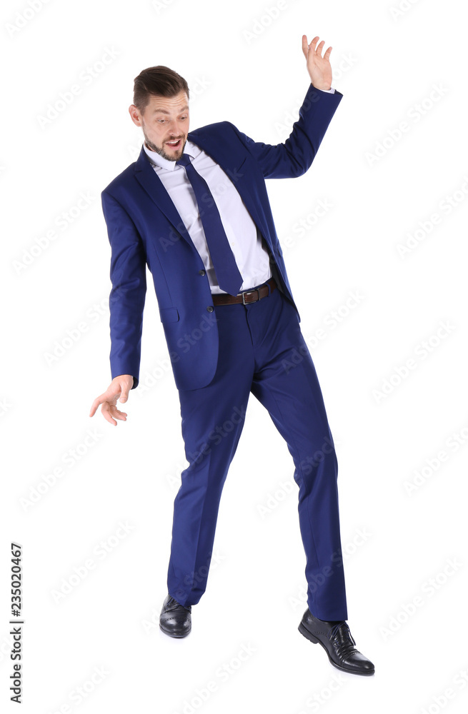 Full length portrait of businessman balancing on white background Full length portrait of businessman balancing on white background