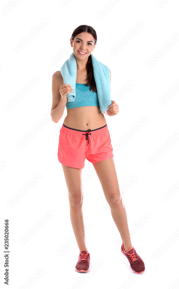 Beautiful young woman in sportswear with towel on white background Beautiful young woman in sportswear with towel on white background
