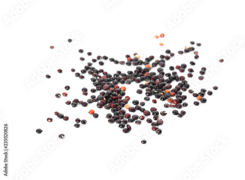 Raw black quinoa seeds on white background