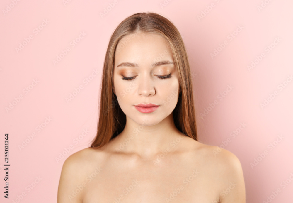 Portrait of beautiful young woman with natural makeup on color background Portrait of beautiful young woman with natural makeup on color background
