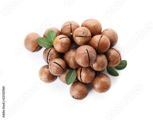 Pile of organic Macadamia nuts on white background, top view