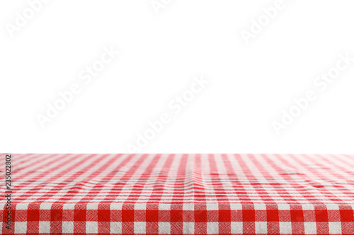 Empty table covered with napkin against white background