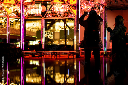 Tourists take pictures of Christmas lights in Tokyo, Japan