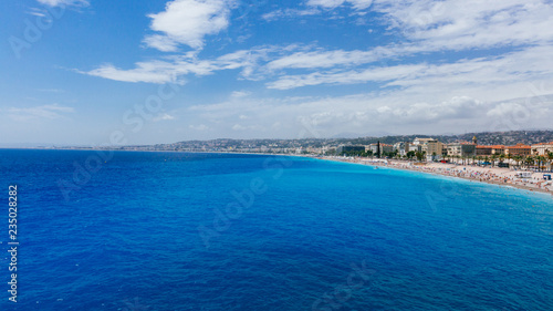 Buildings and beaches next to blue sea in Nice, France © Mark Zhu