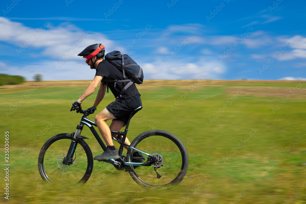 Natural view with cyclist going somewhere with stylish bike Natural view with cyclist going somewhere with stylish bike