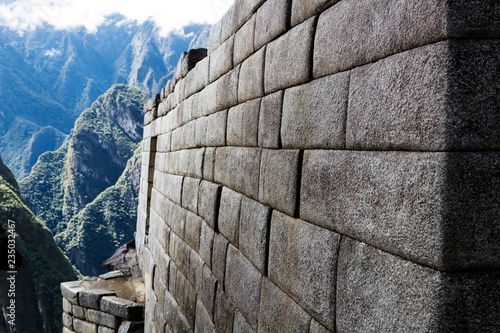Inca Stone Wall With Mountains In Background Machu Picchu Peru