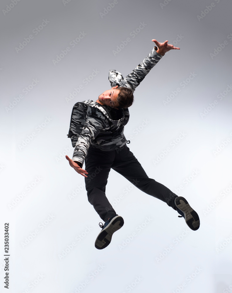 Cool young break dancer isolated on white background
