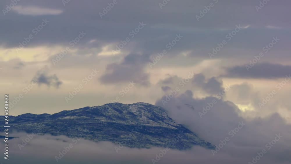 Mountains peaks covered with snow and clouds above timelapse Mountains peaks covered with snow and clouds above timelapse
