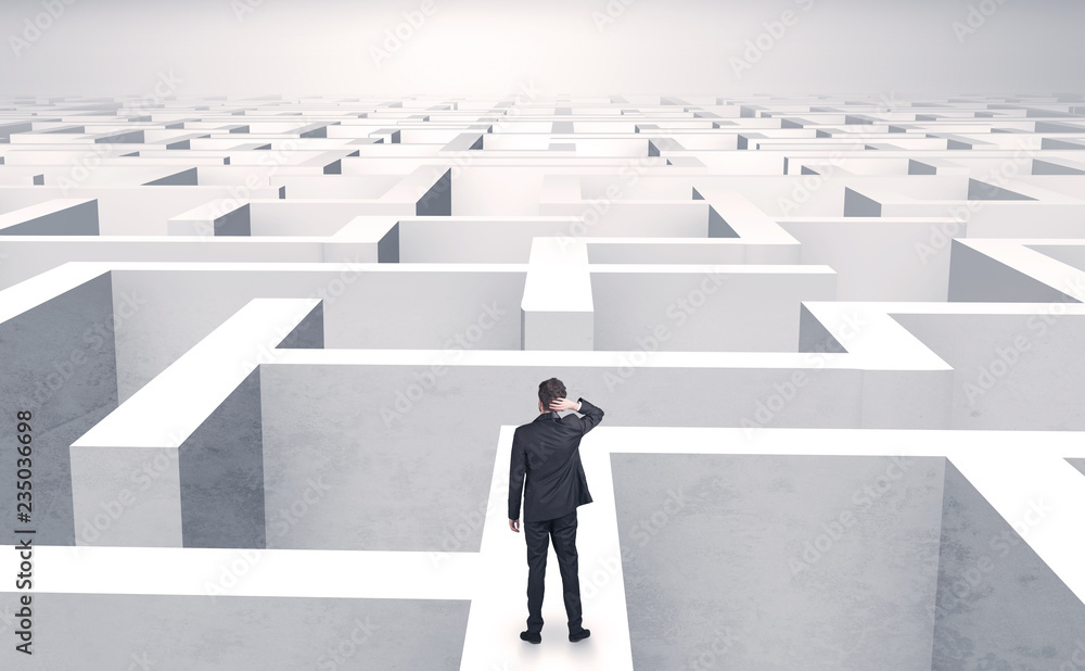 Small businessman in a middle of a huge maze
Small businessman in a middle of a huge maze