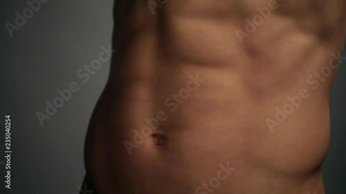 Young topless rolled man posing
