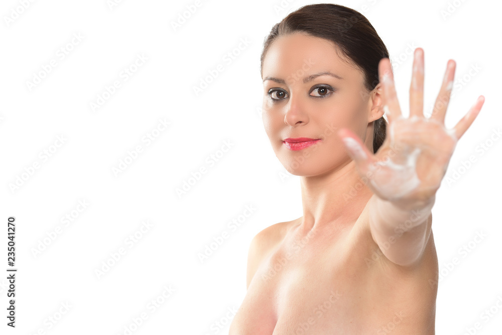 beautiful female model applying body lotion on her body beautiful female model applying body lotion on her body