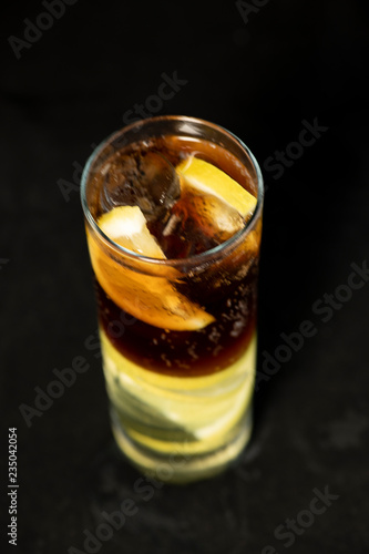 Wallpaper Mural Cuba Libre cocktail with rum, coke and lime juice with lime wedge and full of ices Torontodigital.ca