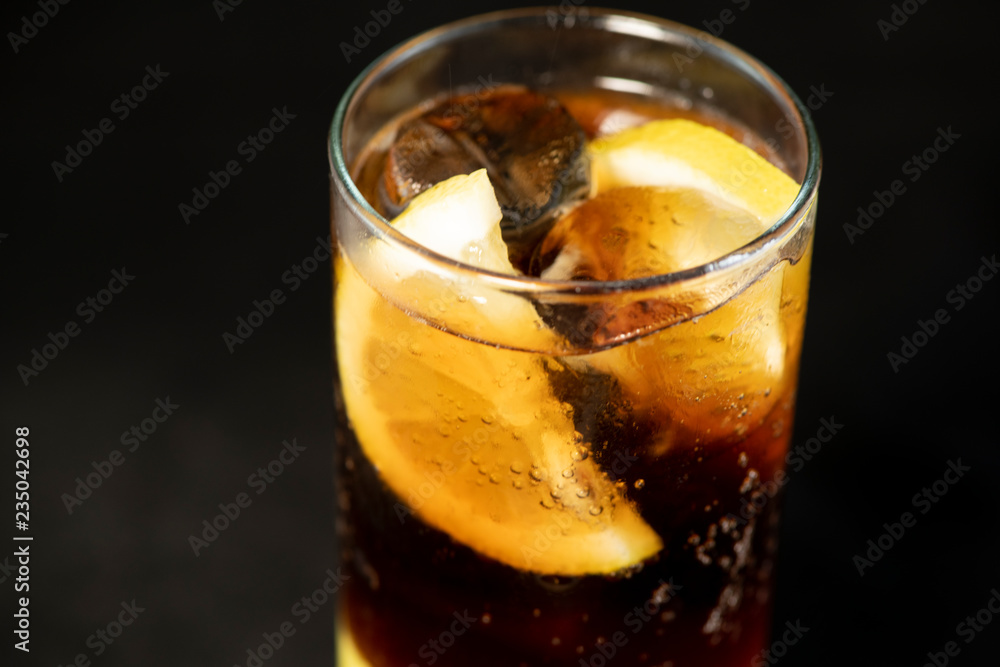 Cuba Libre cocktail with rum, coke and lime juice with lime wedge and full of ices Cuba Libre cocktail with rum, coke and lime juice with lime wedge and full of ices