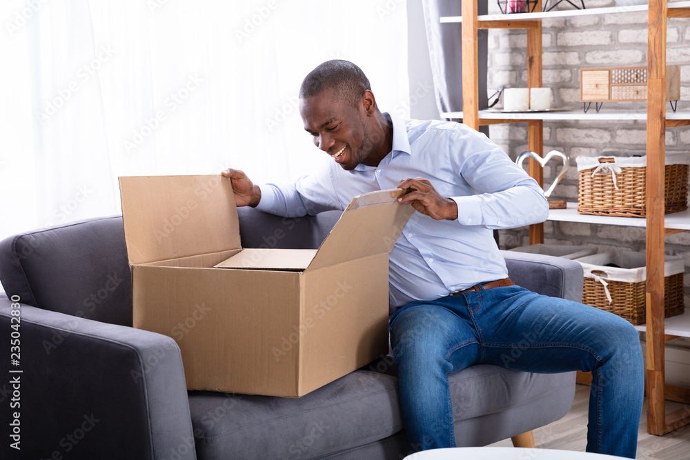 Happy Man Looking Inside Package Happy Man Looking Inside Package