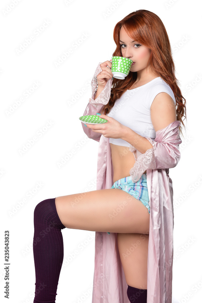 beautiful red headed women drinking coffee-tea and holding cup isolated on white beautiful red headed women drinking coffee-tea and holding cup isolated on white