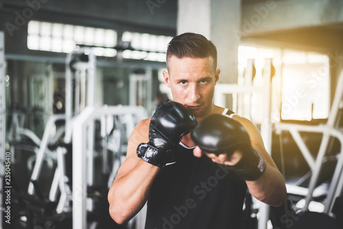 Man boxer punching at a boxing gym,Men boxer training and looking