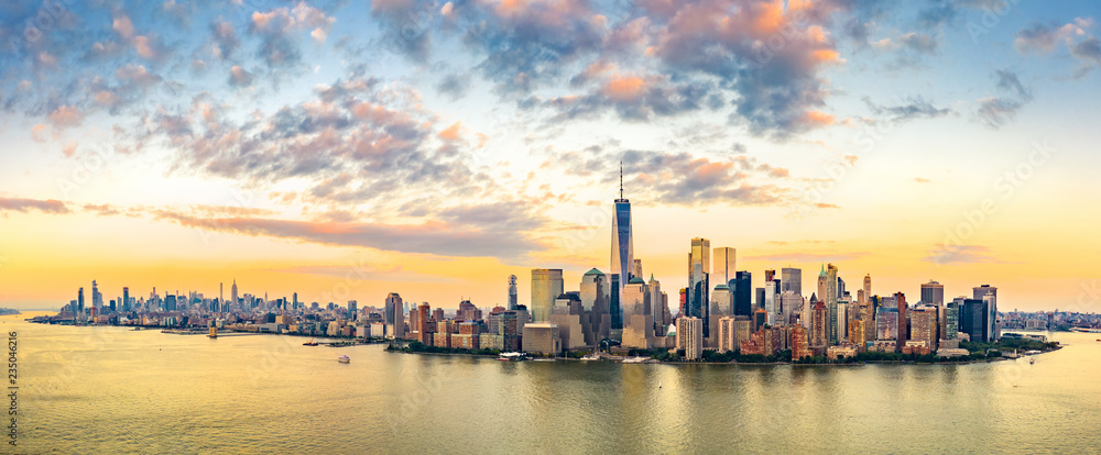 Aerial panorama of New York City skyline at sunset with both midtown and downtown Manhattan