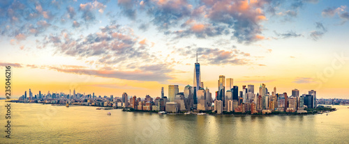 Aerial panorama of New York City skyline at sunset with both midtown and downtown Manhattan