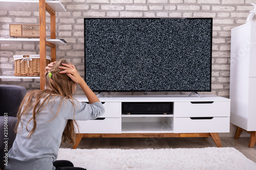 Girl Sitting Near Television With No Signal