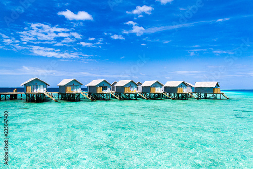 Fototapeta Naklejka Na Ścianę i Meble -  Beautiful tropical Maldives resort hotel and island with beach and sea on sky for holiday vacation background concept